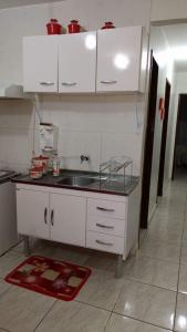 a kitchen with a sink and a counter top at Apartamento no Guará in Brasilia