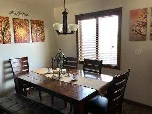 a dining room table and chairs in a room with a window at Modern Hacienda in Ensenada