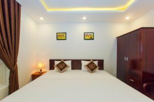 Giường trong phòng chung tại Pebble Homestay