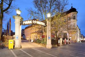 a park world sign in front of a building at Eurostars Park Hotel Maximilian in Regensburg