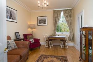 a living room with a couch and a table at The Lodge at Heathfield in Ledbury