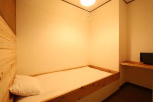 En eller flere senger på et rom på Ikkyu For Backpackers 19