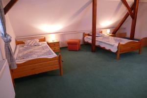 Postel nebo postele na pokoji v ubytování Kutschergasthof Am Sonnenstein