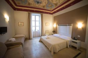 Postel nebo postele na pokoji v ubytování Hotel Gargallo