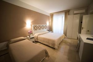 Ένα ή περισσότερα κρεβάτια σε δωμάτιο στο Hotel Gargallo
