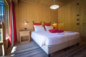 Postel nebo postele na pokoji v ubytování Hotel Funivia