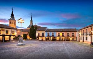 a town square with a street light and a church at Iberia TM Apartments Real Villa in Navalcarnero