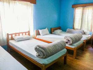 Llit o llits en una habitació de Nepalaya Eco Hostel