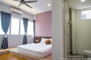 Postel nebo postele na pokoji v ubytování Shuang Yang Sekinchan Homestay
