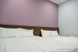 Postel nebo postele na pokoji v ubytování Shuang Yang Sekinchan Homestay
