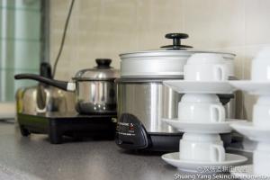 Kuchyň nebo kuchyňský kout v ubytování Shuang Yang Sekinchan Homestay