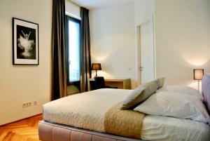 Posteľ alebo postele v izbe v ubytovaní BonusFeature Apartments