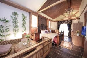 Postel nebo postele na pokoji v ubytování Luxembourg Hills Homestay