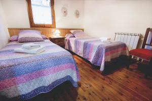 Postel nebo postele na pokoji v ubytování LA GINESTA 1, Apartaments de munyanya