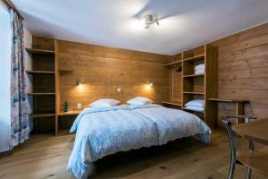 Voodi või voodid majutusasutuse La Vallée Hôtel &Spa toas