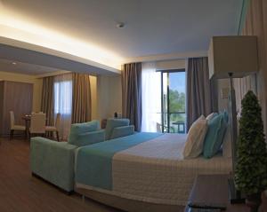 Ένα ή περισσότερα κρεβάτια σε δωμάτιο στο Awa Resort Hotel