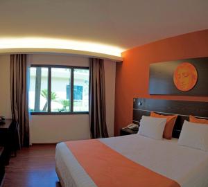 Ένα ή περισσότερα κρεβάτια σε δωμάτιο στο Awa Resort Hotel