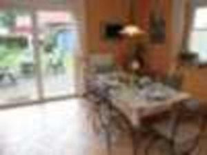a blurry picture of a living room with a table at Haus am Meer Ostsee Insel Rügen Fischerweg 3 Wlan in Glowe +25 photos
