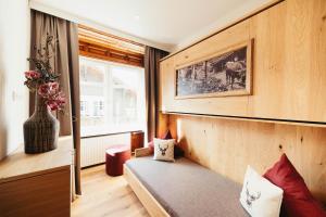 Posteľ alebo postele v izbe v ubytovaní adler alpen apartments