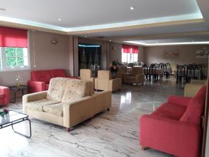 a living room with couches and chairs and a table at Hotel Castro in Santiago de Compostela