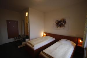 Ein Bett oder Betten in einem Zimmer der Unterkunft Hotel-Gaststätte Mutter Buermann