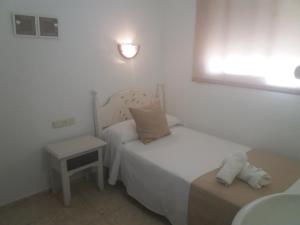 Ένα ή περισσότερα κρεβάτια σε δωμάτιο στο Hospederia Islasol