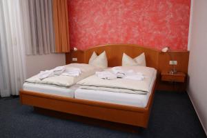 Postel nebo postele na pokoji v ubytování Hotel Kuhfelder Hof + 37 fotografií