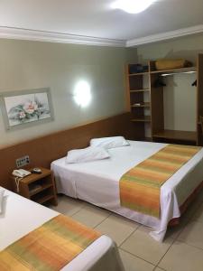 Postel nebo postele na pokoji v ubytování Vila Verde Hotel