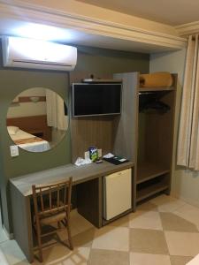 TV a/nebo společenská místnost v ubytování Vila Verde Hotel