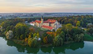 an aerial view of a castle on an island in the water at Palace Hotel in Nyasvizh