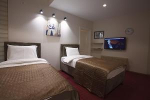 Letto o letti in una camera di Apartmani Brocat