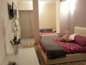 A bed or beds in a room at Cuorematto
