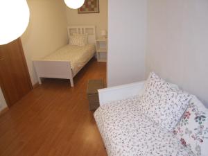 Ένα ή περισσότερα κρεβάτια σε δωμάτιο στο Allotjament turístic Cal Minguell
