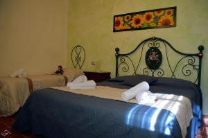 Postel nebo postele na pokoji v ubytování Agriturismo La Spiga