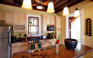 A kitchen or kitchenette at Hermosa Cove Villa Resort & Suites