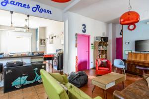 a living room with a couch and a table at Hostel of the Sun in Naples