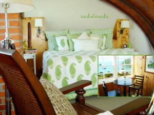 a bedroom with a bed and a table and chairs at Trinidad Bay Bed and Breakfast Hotel in Trinidad