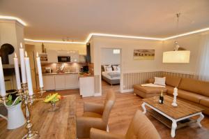 a living room with a couch and a table at Villa Strandblick 11 in Zingst