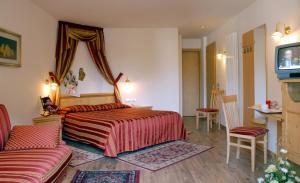 Postel nebo postele na pokoji v ubytování Hotel Sass Maor