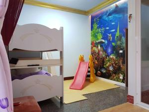 Postel nebo postele na pokoji v ubytování Shuanghu Garden B&B