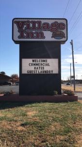 a welcome sign for a wireless commissary sign at Village Inn Salina in Salina