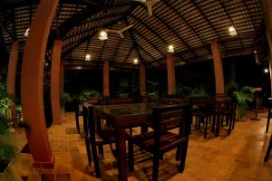 a dining area with tables and chairs in a restaurant at Safari Lodge Yala in Kataragama