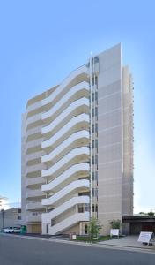 a rendering of a large office building at Residence Hotel Hakata 8 in Fukuoka +18 photos