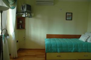 Ένα ή περισσότερα κρεβάτια σε δωμάτιο στο Hotel Tehnograd