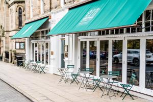 a group of chairs and tables outside of a building at The Beaumont Hexham in Hexham