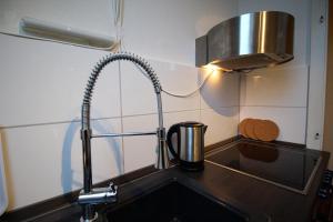 A kitchen or kitchenette at Downtown Apartments Oldenburg