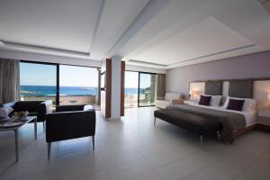 Un ou plusieurs lits dans un hébergement de l'établissement Alimounda Mare Hotel