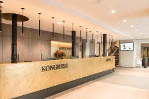 a lobby of a koreanoreanoreanoreanorean korean kindness store at Kreuz Bern Modern City Hotel in Bern
