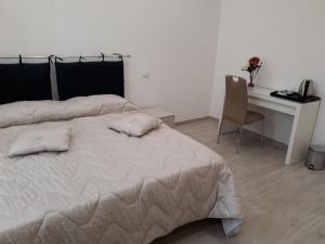 Postel nebo postele na pokoji v ubytování Rosa del Salento