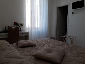 Postel nebo postele na pokoji v ubytování Rosa del Salento